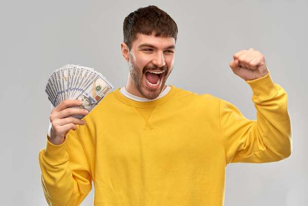 happy young man with money celebrating success - Fotografie, Obrázek