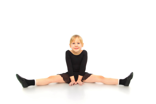 Children's fitness. Active girl doing fitness exercises, isolate - Foto, afbeelding