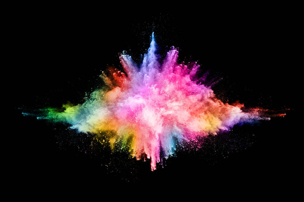 Abstract colored dust explosion on a black background.abstract powder splatted background,Freeze motion of color powder exploding/throwing color powder, multicolored glitter texture. - Photo, Image