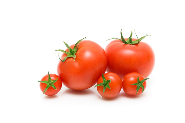 Ripe tomatoes on a white background closeup - 写真・画像