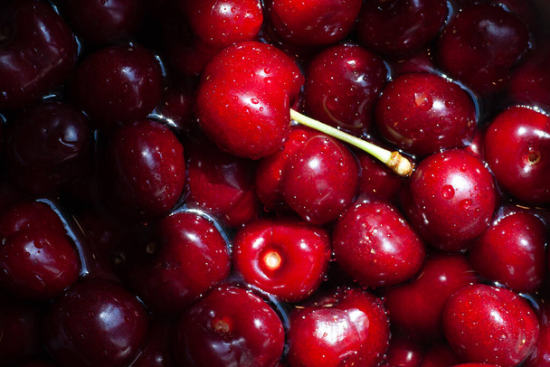 Great ripe red sweet cherry closeup background for a dining napkin and summer towel full frame - Foto, afbeelding