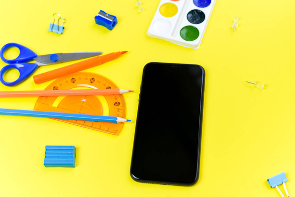 View from above. Flat lay. Mock up blank screen mobile phone for back to school background concept. - Photo, Image
