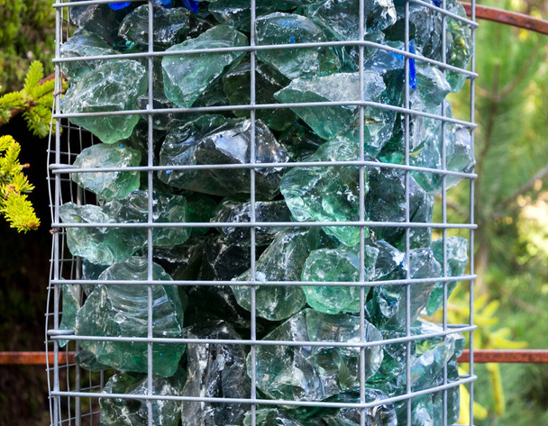 Mesh column filled with glass mass stones - Photo, Image