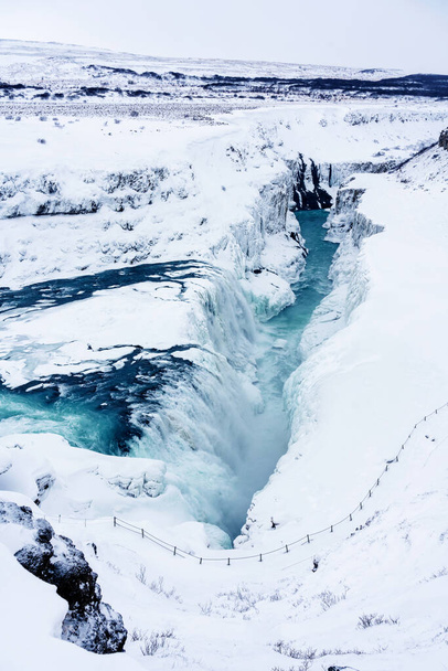 The Gullfoss Falls in Iceland in winter when the falls are partially frozen. - Fotoğraf, Görsel
