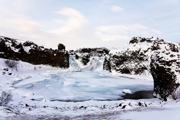 Hjalparfoss waterfall in Iceland in winter - Foto, afbeelding