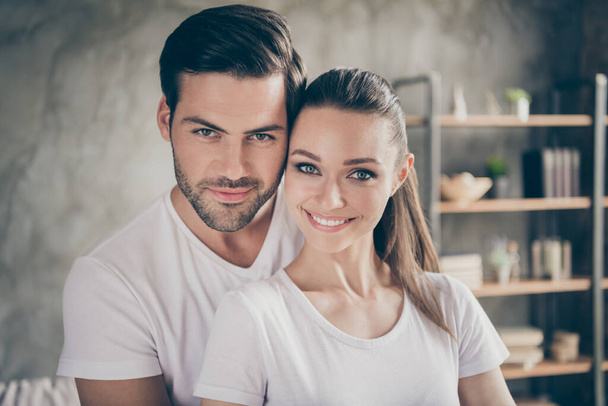 Closeup photo of pretty charming lady handsome guy couple relaxing stand close stay home good mood quarantine hugging spend time together toothy smiling living room indoors - Valokuva, kuva