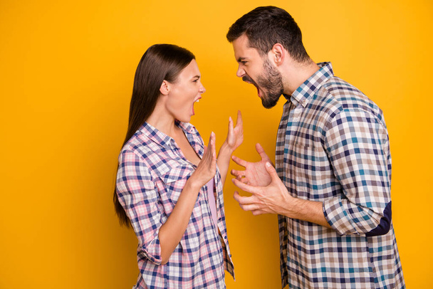 Profile photo furious lady guy couple girlfriend boyfriend yell each other scandal cant stay home together longer wear casual plaid shirts jeans isolated yellow color background - 写真・画像
