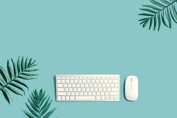 Computer keyboard and mouse with tropical plants - Fotó, kép