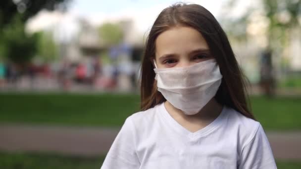 Happy child rejoices over end of coronavirus pandemic (COVID-19) - Materiał filmowy, wideo