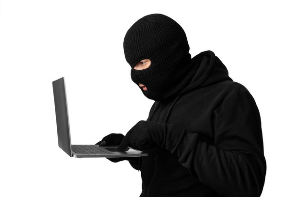 Hacker downloading private information off a computer - Fotó, kép