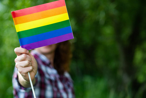 woman holding rainbow flag LGBT rights - Photo, Image