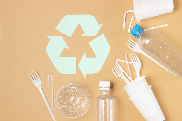 Plastic waste dishes, bottles, glasses, trash. Nature pollution. Recycling garbage and waste. - Photo, Image
