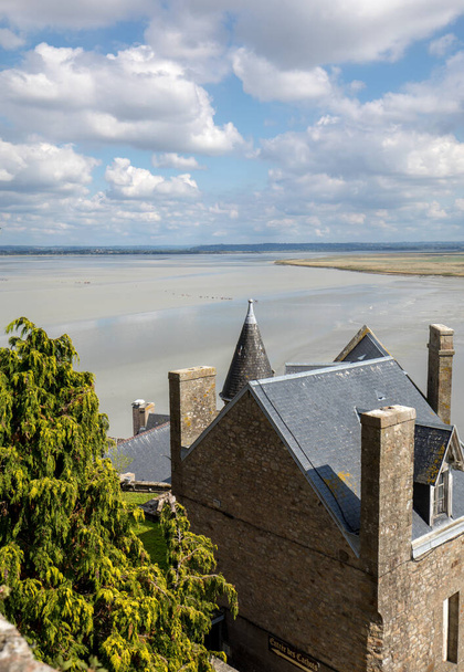Le Mont-Saint-Michel, France - September 13, 2018: Mont Saint-Michel, the monastery and village on a tidal island between Brittany and Normandy, France - Photo, Image