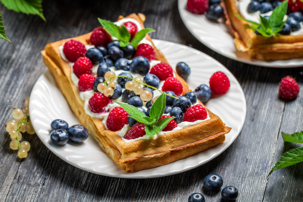 Closeup of waffles with fresh berry fruit - Foto, afbeelding
