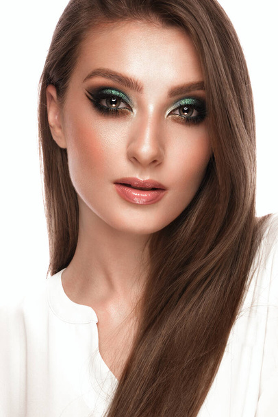Beautiful girl with bright fashionable make-up and long thick hair. Beauty face. - Foto, imagen