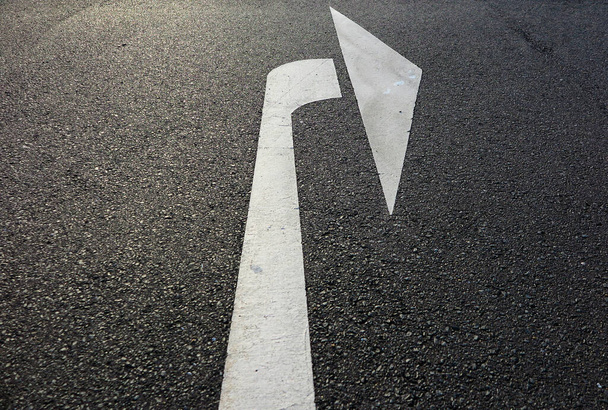 Close up of isolated white arrow on asphalt road showing right direction - Germany - Photo, Image