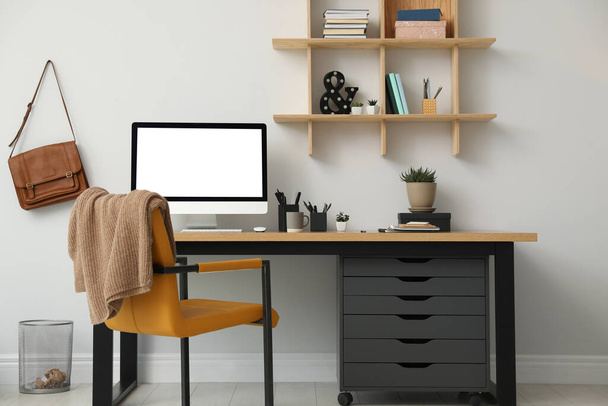 Stylish room interior with modern comfortable workplace - 写真・画像