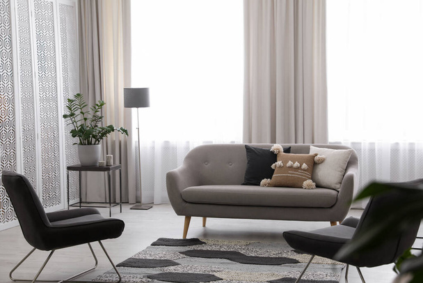 Modern living room interior with comfortable sofa and armchairs - Foto, immagini
