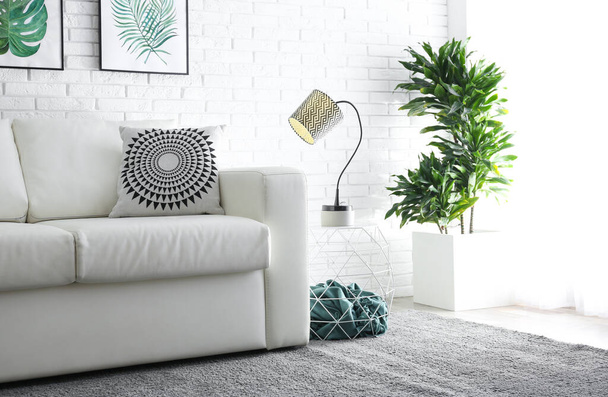 Comfortable white sofa in modern room. Interior design - Zdjęcie, obraz