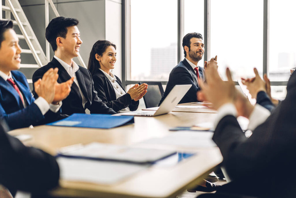 Businessman speaker presentation and discussing meeting strategy sharing ideas thoughts.Creative work group of casual business people clapping hands in modern office.Success concept - Photo, Image