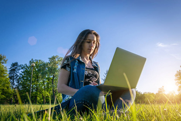 Laptop, computer business technology. Student girl working on tablet in summer nature park. People person outdoor. Woman online work outside. Happy hipster young distance learning concept. - Photo, Image