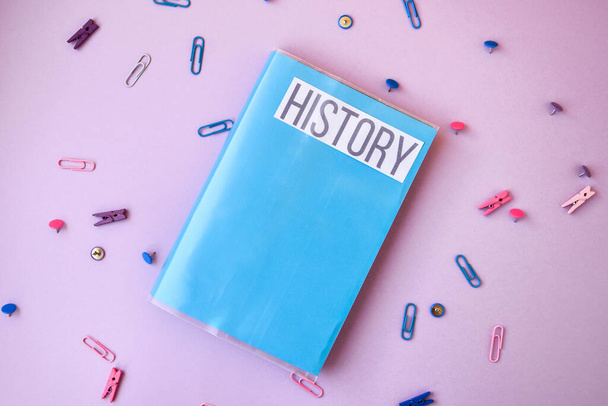 school book. history with supplies stationery on color background, back to school, ruler, pencils - Photo, Image