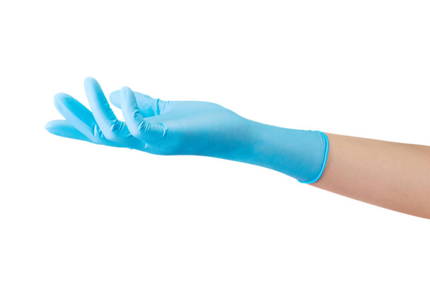 Doctor's hand in sterile medical gloves showing something on palm isolated on white background with clipping path. Concept of protection against pandemic and viruses. - Photo, Image