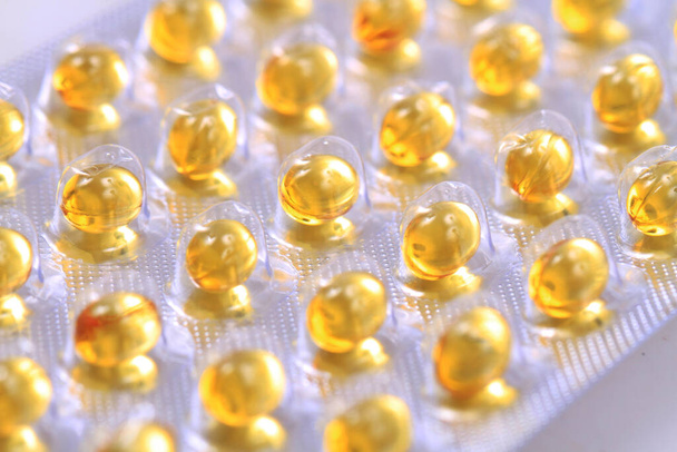 vitamin D pills as very nice pharmacy background - Foto, Imagem