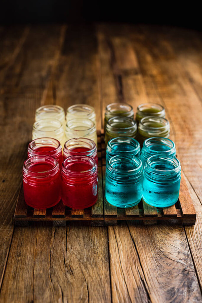 Different kinds of alcoholic shooters or shots, red, green, yellow, blue - Foto, imagen