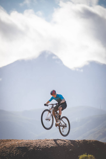 Close up image of a mountain biker speeding downhill on a mountain bike track - Zdjęcie, obraz