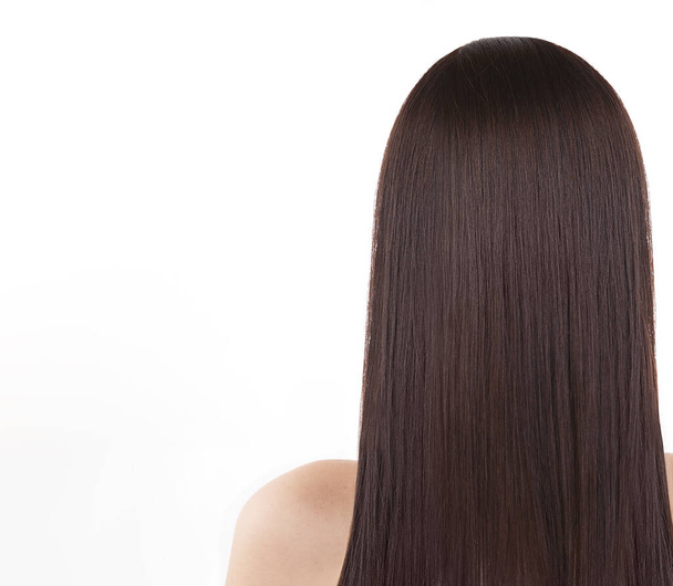 girl with long straight healthy dark hair. - Valokuva, kuva