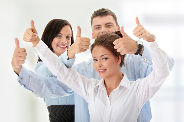 Business team with thumbs up - Фото, изображение