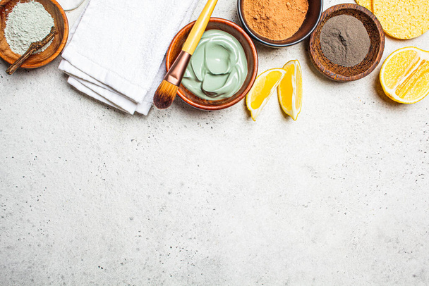 Different types of dry clay in a wooden bowl for the preparation of facial masks. Skincare concept. - Foto, immagini