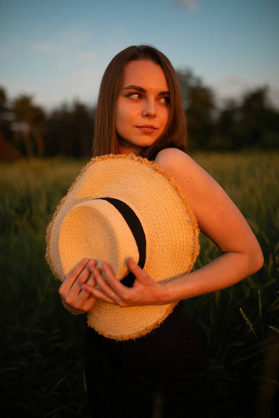 sun set photo of girl in the field, dress, sunset, depth of field, profile, women outdoors - Photo, Image
