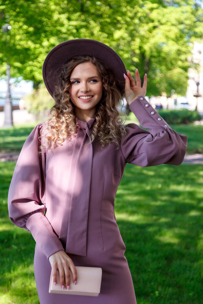 Portrait of woman dressed in French with hat. French style of Paris. Close-up of French woman in stylish clothes, posing and smiling. Place for an inscription or logo - Φωτογραφία, εικόνα