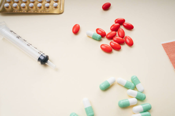 Assorted medical drugs and syringe on white background. - Photo, Image