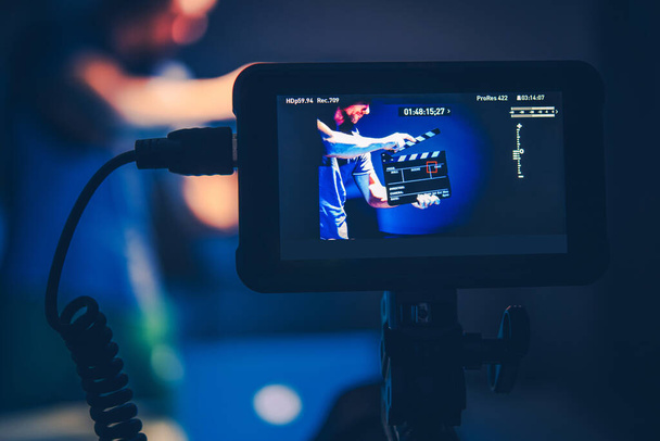 Videography Theme with Camera Operator Taking Shots of Men with Clapperboard. Video Display Monitor Close Up. Motion Picture Technology. - Foto, Bild
