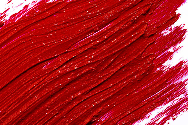 Glossy red lipstick stain swatch isolated on white - Foto, Imagem