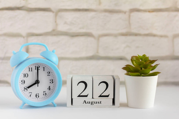 June 12nd. Day 12 Of Month, Calendar Date. White Alarm Clock On Red  Background With Calendar Date. Concept Of Time, Deadline, Time To Work,  Morning. Summer Month, Day Of The Year Concept