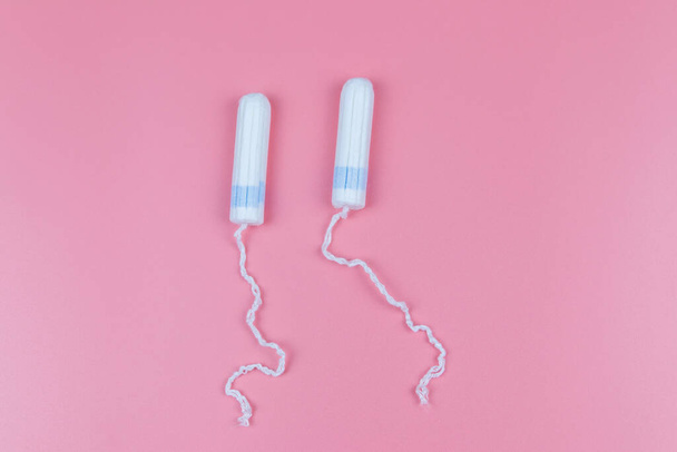 Tampons on a pastel pink background. Top view - Fotografie, Obrázek