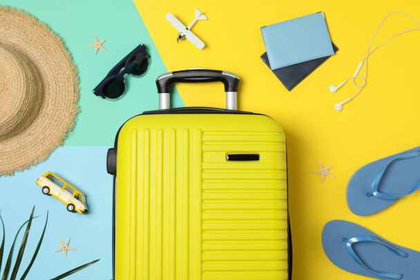 Travel accessories on two tone background, top view. Travel blogger - 写真・画像