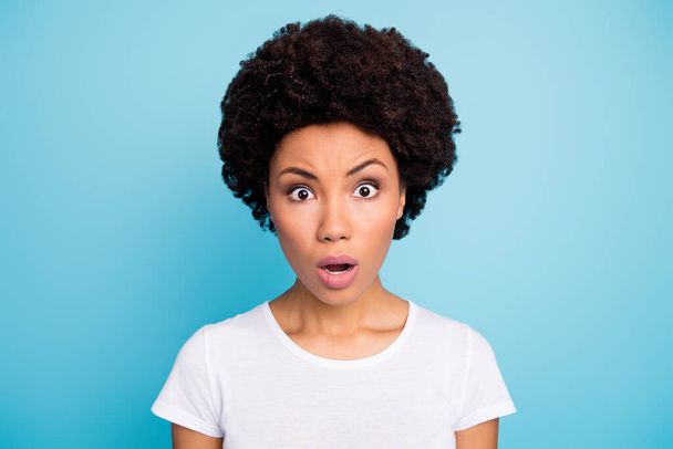 Closeup photo of attractive pretty dark skin wavy lady open mouth awful news speechless eyes full of fear wear casual white t-shirt isolated blue color background - Φωτογραφία, εικόνα