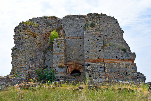 Greece, ruin of fortified wall from medieval castle Anaktoroupolis on Aegean Sea in Nea Peramos - Photo, Image