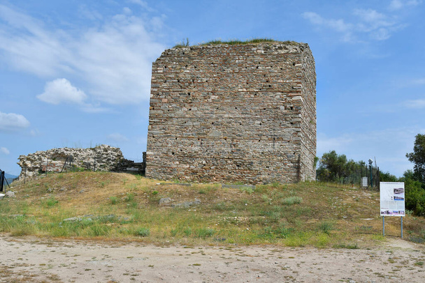 Kavala, Greece - June 12, 2019: Ruin and information board of medieval castle Anaktoroupolis in Nea Peramos - Photo, Image