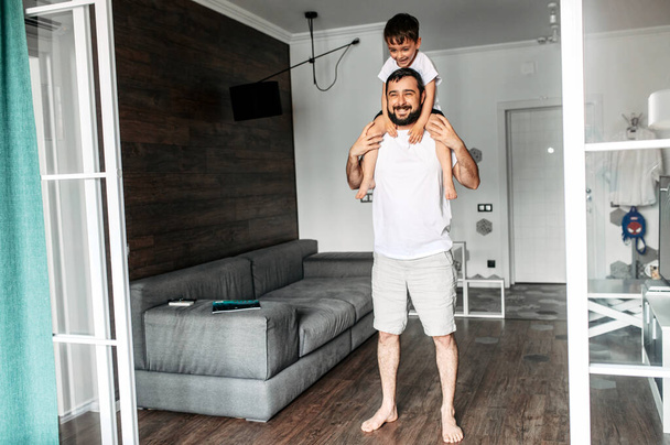 Father and little son are doing sports exercises - 写真・画像