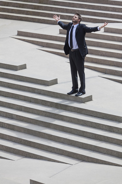 Businessman Arms Outstretched on Steps - Фото, зображення