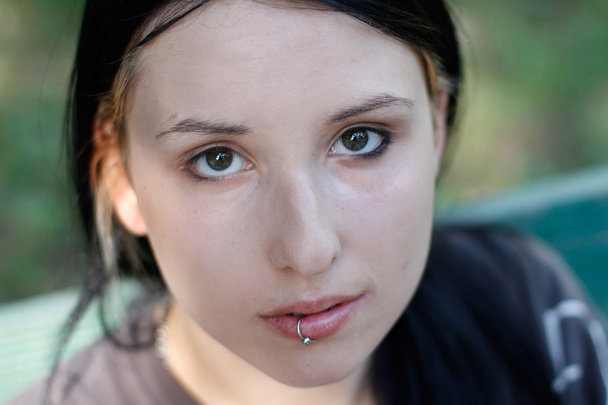 Girl with pierced lip looking at the camera - Fotografie, Obrázek