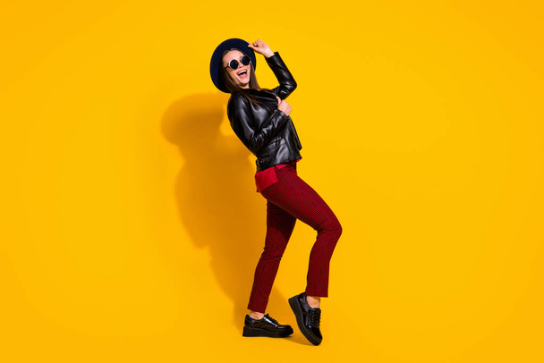 Full length body size view of her she nice-looking attractive lovely pretty cheerful cheery straight-haired girl dancing having fun rest isolated on bright vivid shine vibrant yellow color background - Foto, immagini