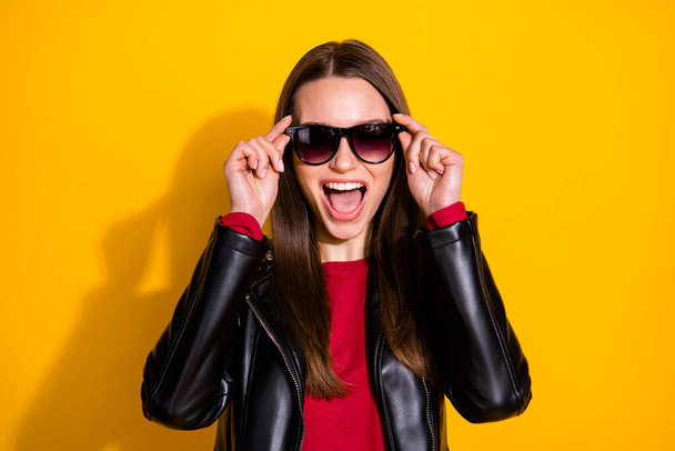 Close-up portrait of her she nice-looking attractive lovely cool cheerful cheery straight-haired girl touching specs enjoying isolated on bright vivid shine vibrant yellow color background - Zdjęcie, obraz