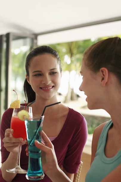 young women toasting drinks - Photo, image